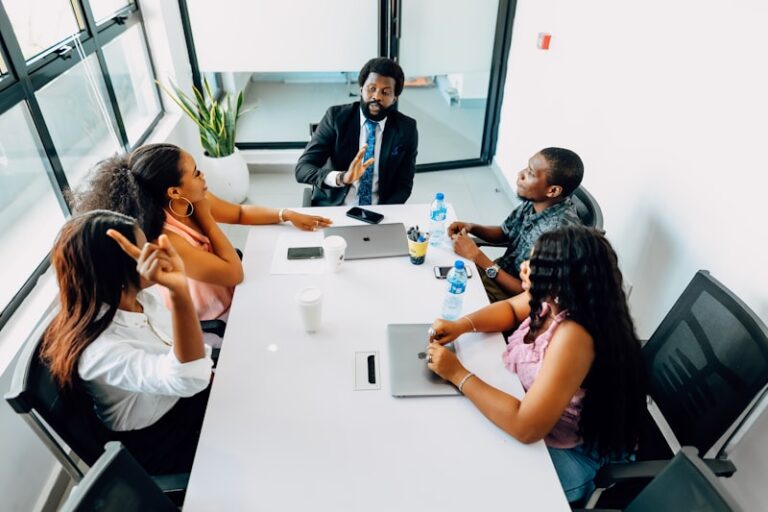 Black professionals in conference room workshop group discussion