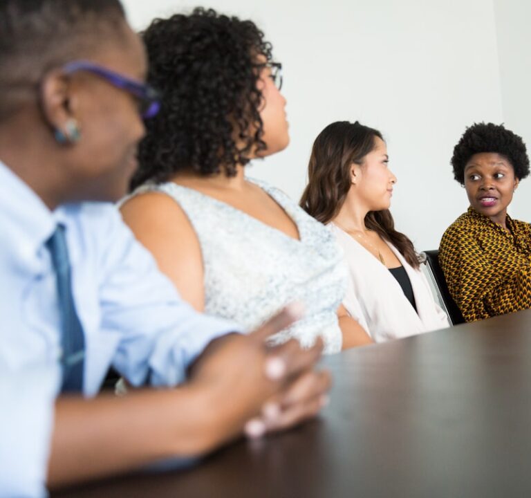 Black professionals in a group discussion